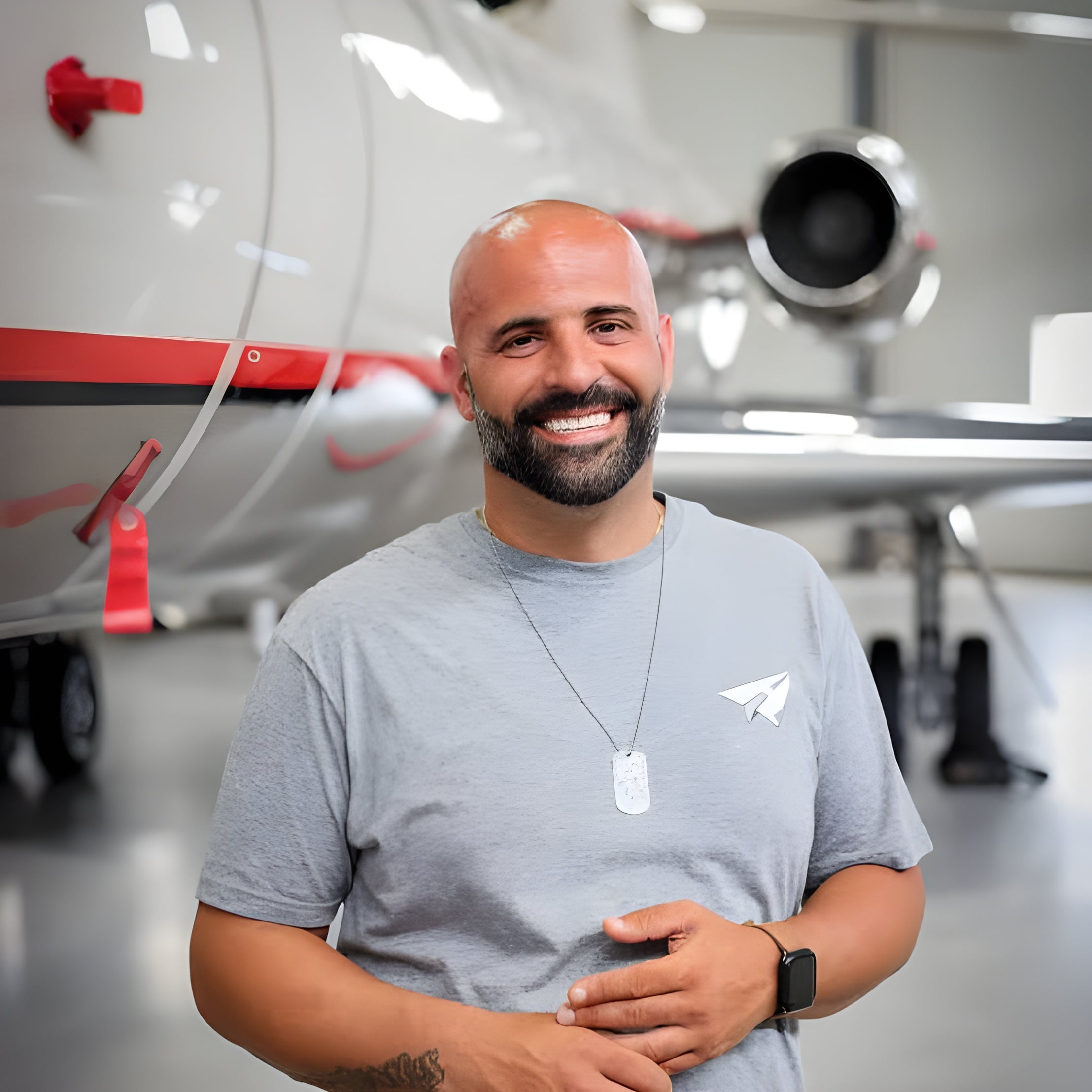 Antonio Ferrara standing in an aircraft hangar